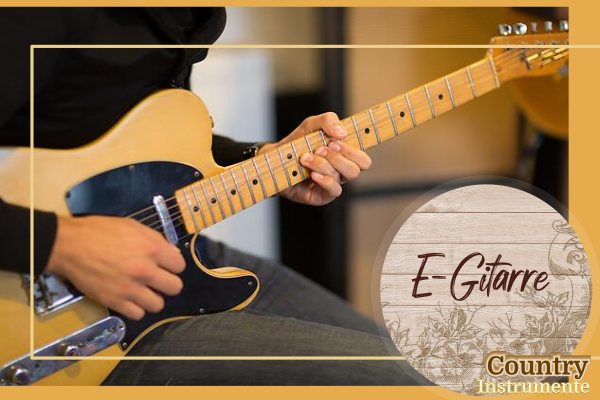 kuenstler spielt e-gitarre